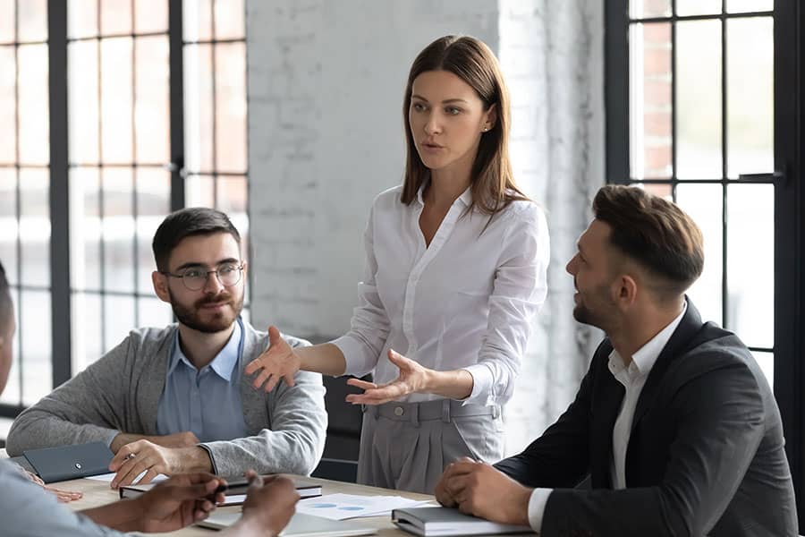Three people in a business meeting