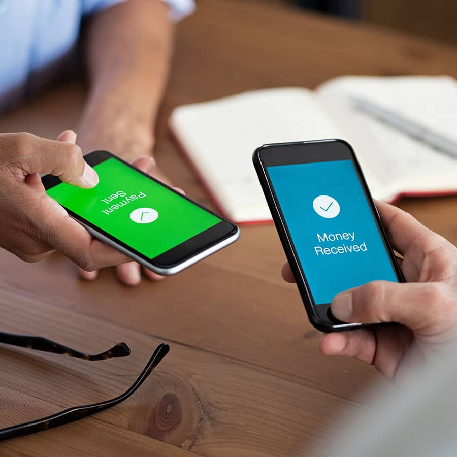 Two phone screens saying Payment Sent and Money Received
