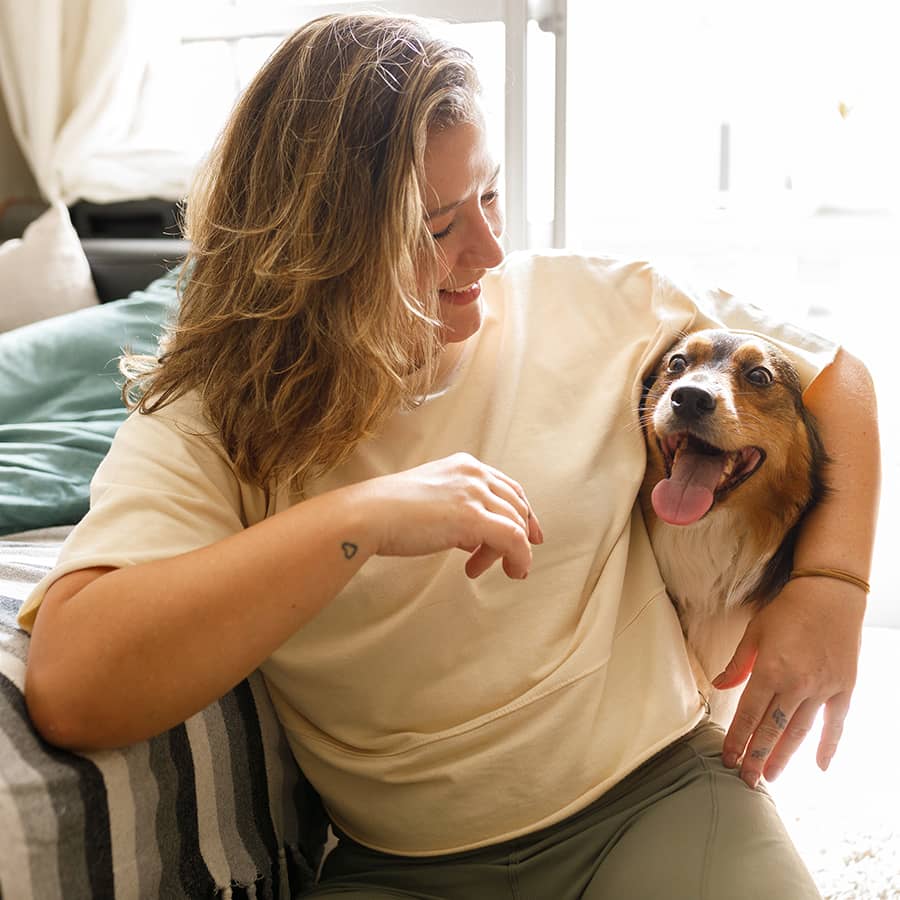 A woman hugging her dog