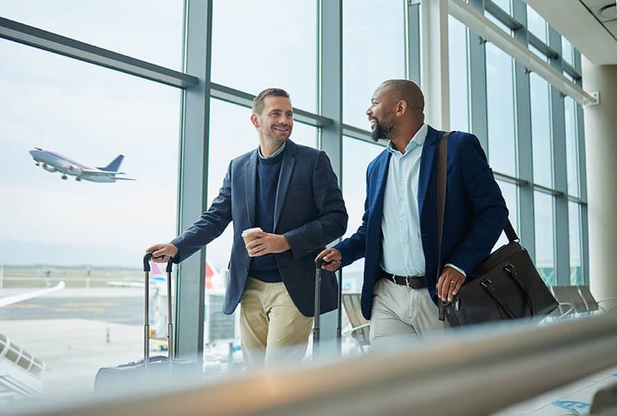 Two business men walking through the airport