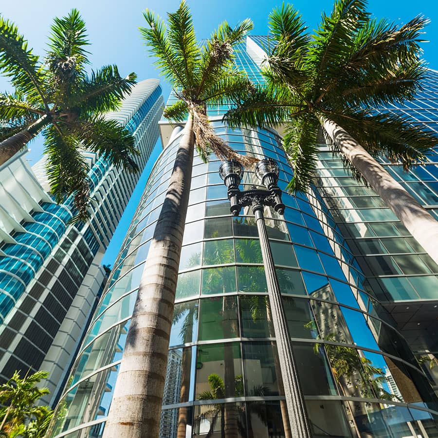 Looking up at large skyscraper buildings