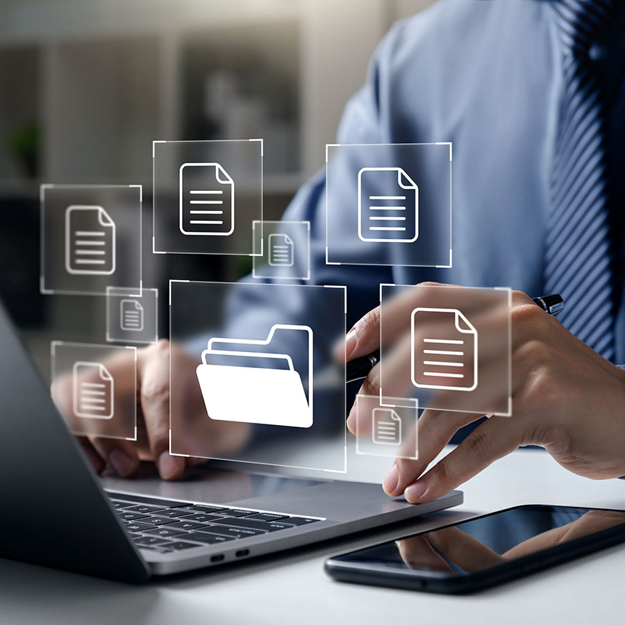 A laptop showing file icons