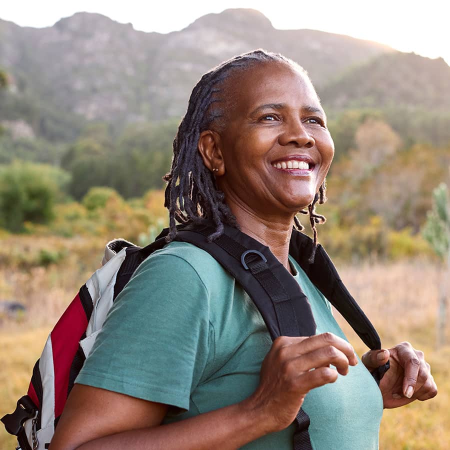A woman backpacking in the hills